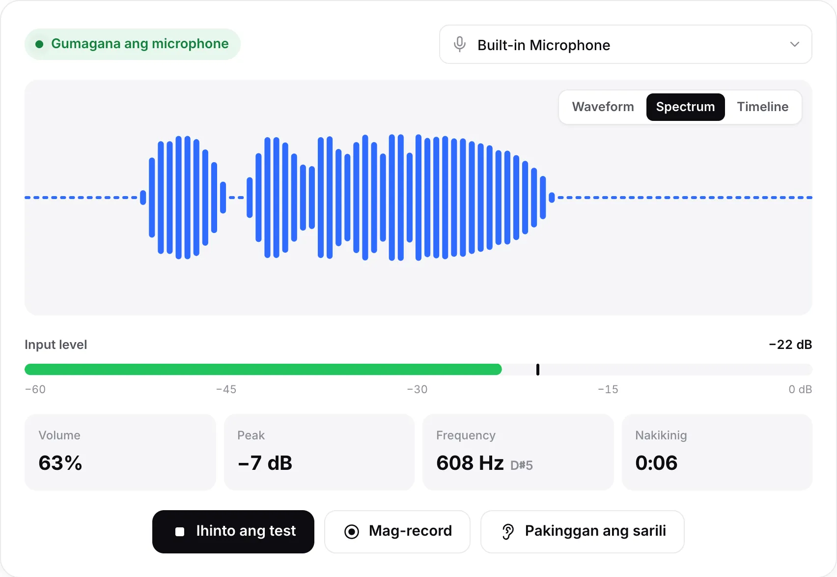 Ang mic test sa Spectrum view na may gumagalaw na mga bar, input level na −23 dB at berdeng status na “Gumagana ang microphone”