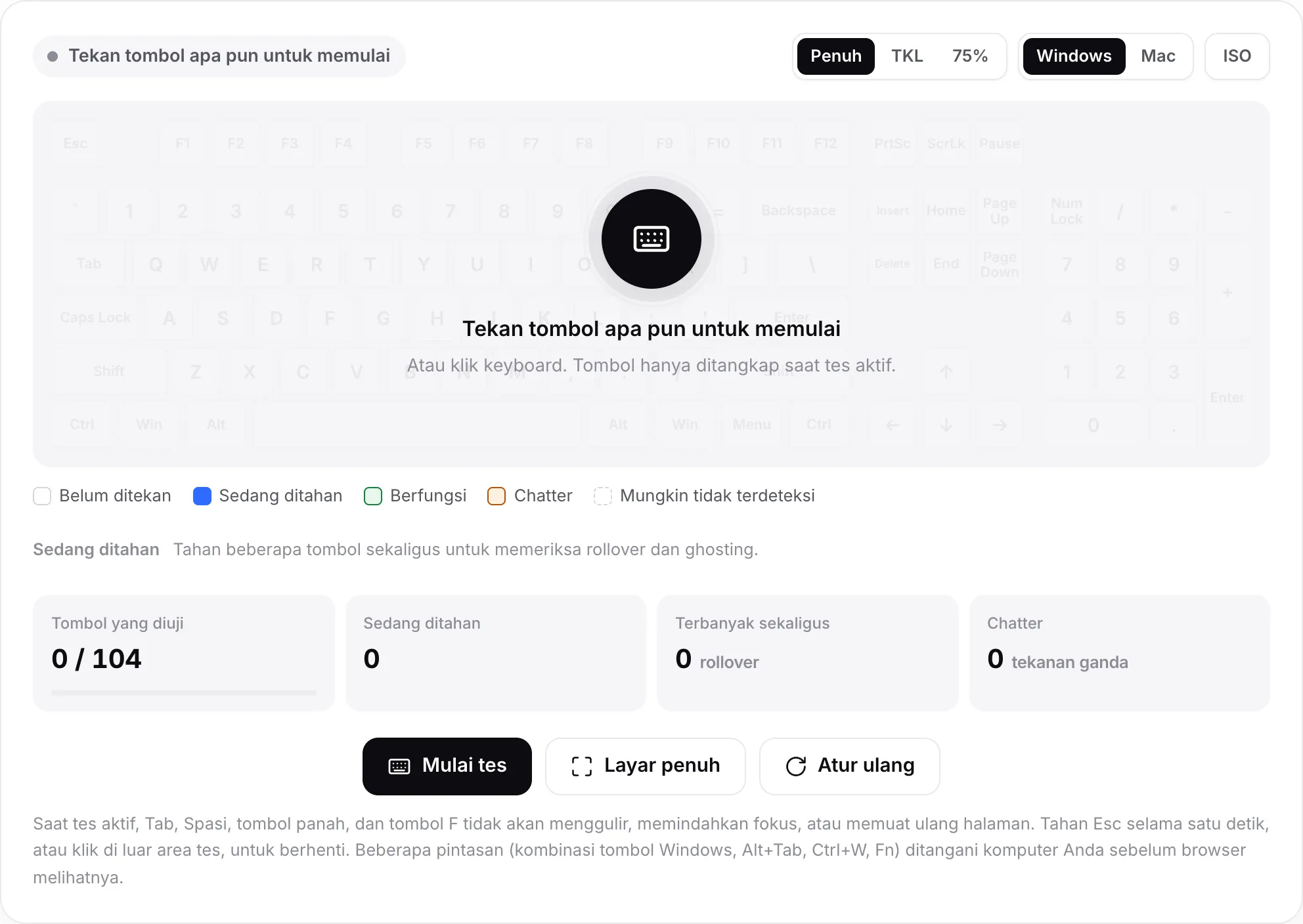 Tes keyboard sebelum dimulai, dengan pesan “Tekan tombol apa pun untuk memulai” di atas keyboard yang memudar