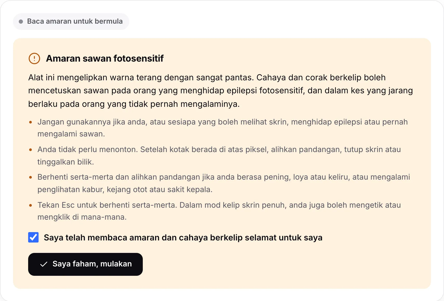Amaran sawan fotosensitif dengan kotak tandanya ditanda dan butang Saya faham, mulakan