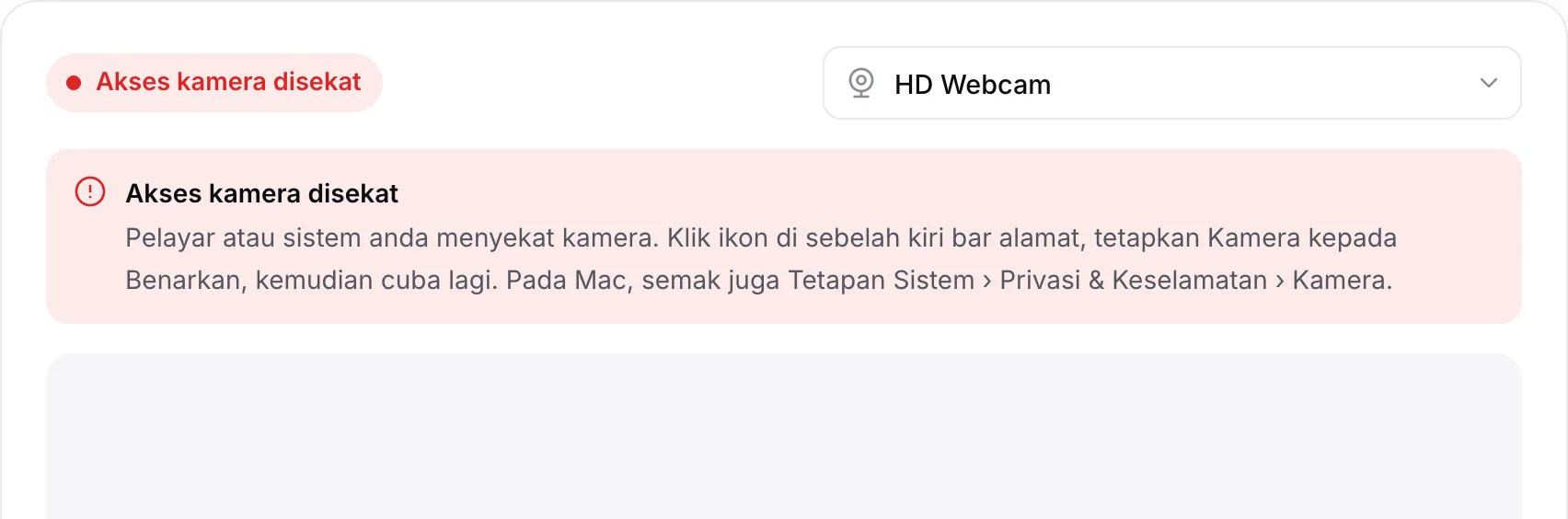 Cermin kamera web yang menunjukkan mesej merah “Akses kamera disekat” beserta arahan