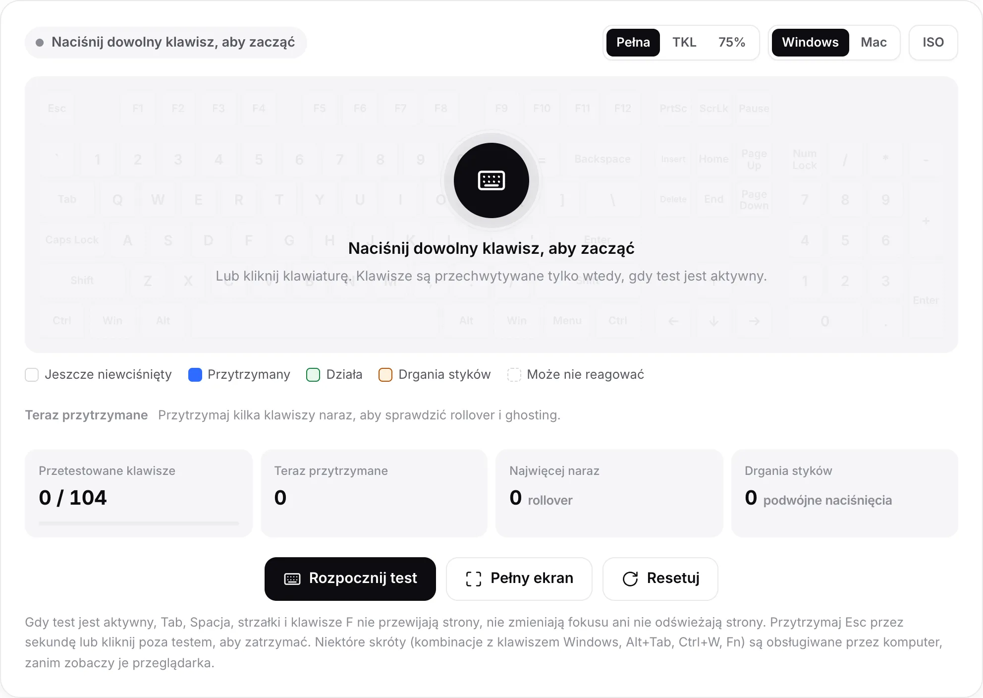 Test klawiatury przed startem, z komunikatem „Naciśnij dowolny klawisz, aby zacząć” nad wyblakłą klawiaturą