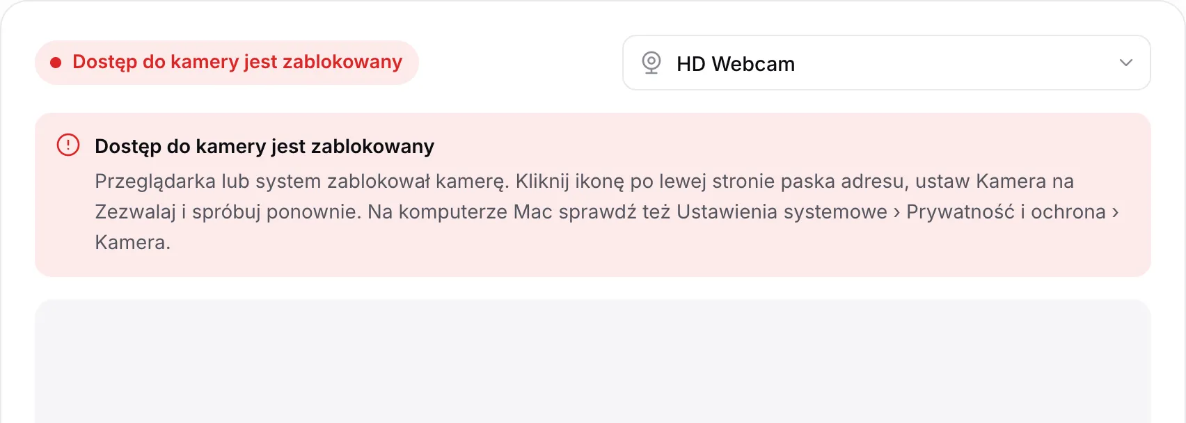 Lusterko z kamerki z czerwonym komunikatem „Dostęp do kamery jest zablokowany” i instrukcją