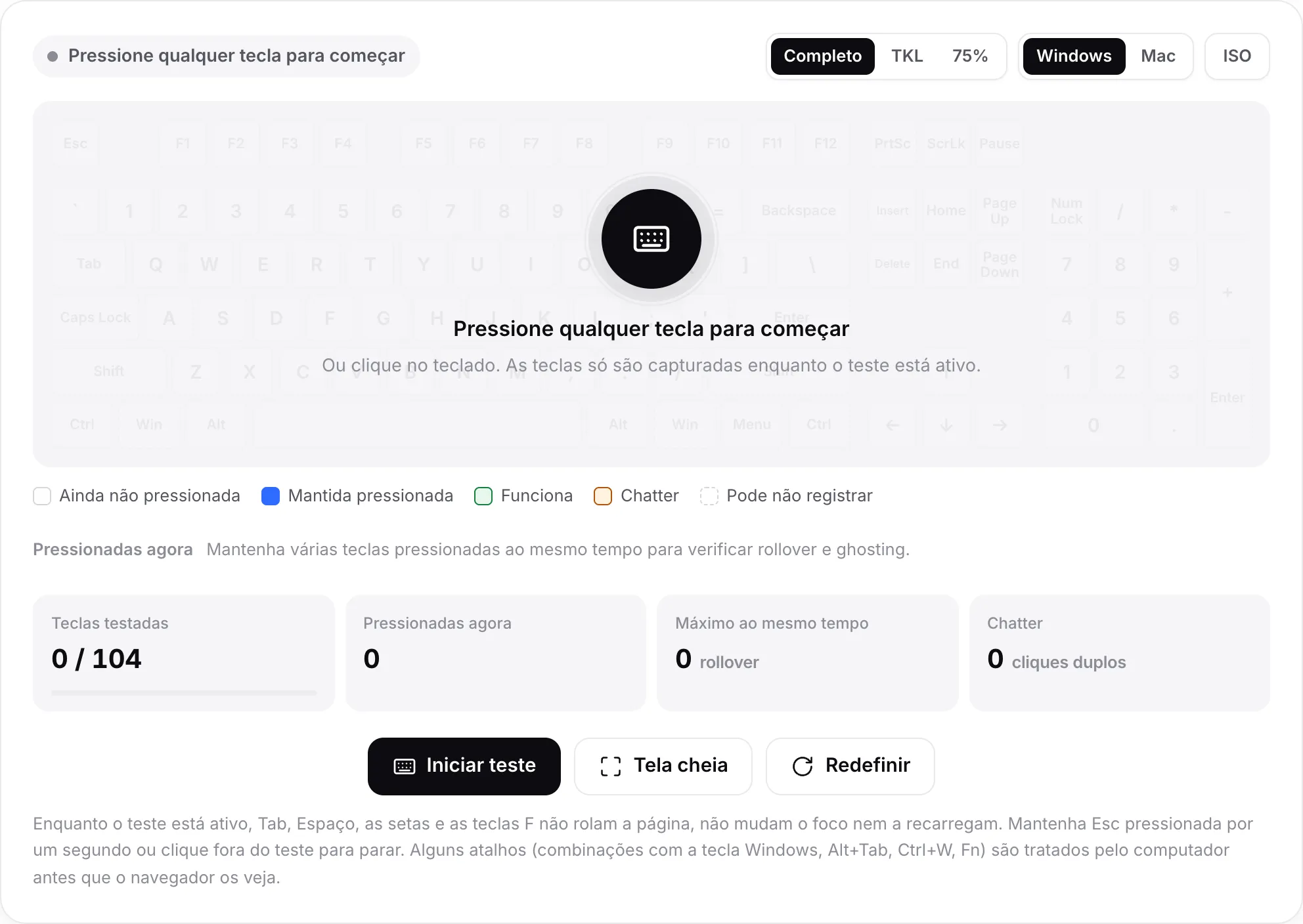 O teste de teclado antes de começar, com a mensagem “Pressione qualquer tecla para começar” sobre um teclado esmaecido