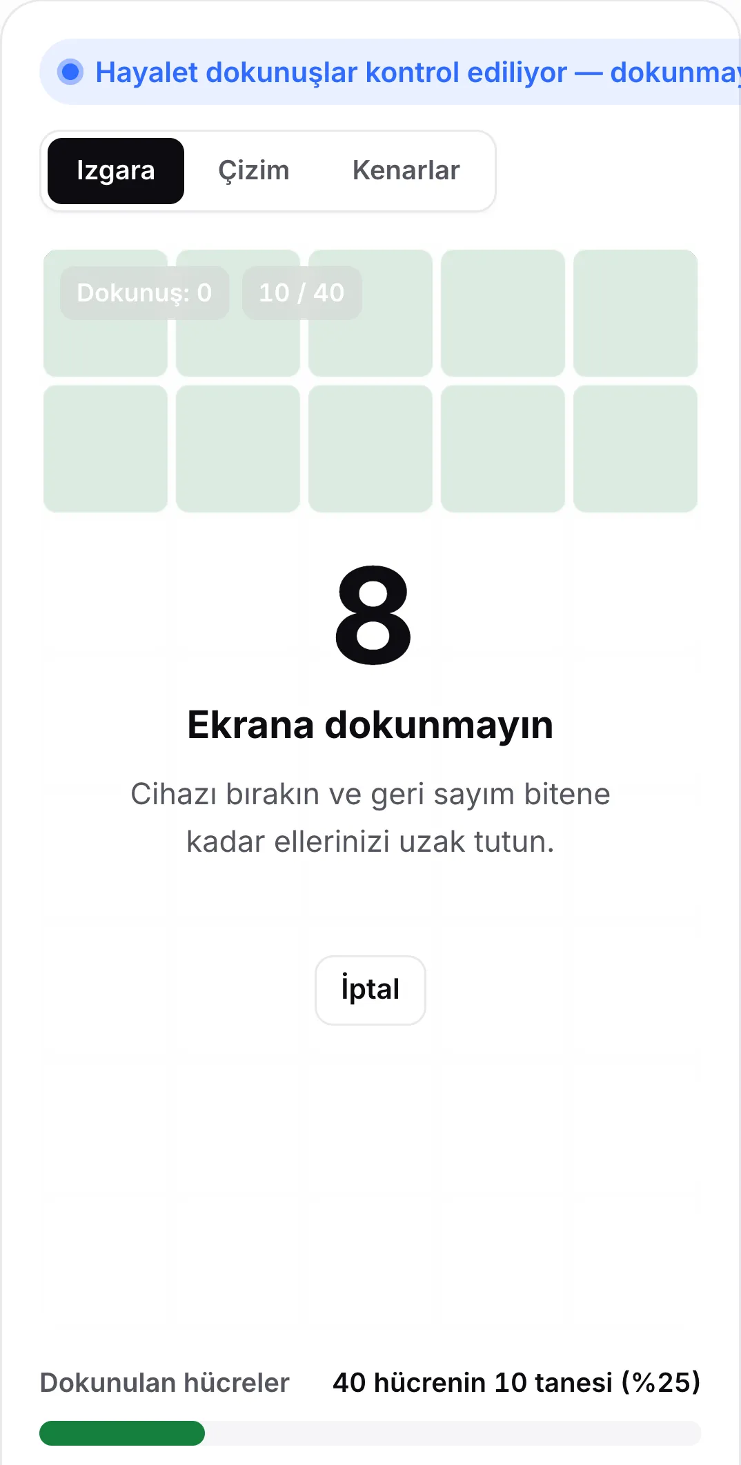 8 saniyede geri sayan, “Ekrana dokunmayın” mesajı ve İptal düğmesi olan hayalet dokunuş kontrolü