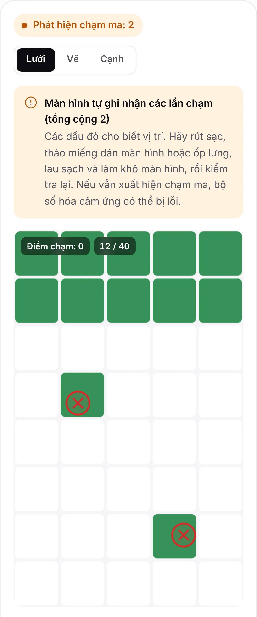 Kết quả kiểm tra chạm ma: trạng thái màu cam “Phát hiện chạm ma: 2”, lời khuyên rút sạc và lau màn hình, và hai dấu đỏ trên lưới